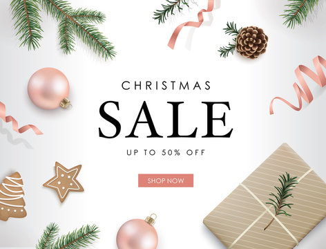 Christmas sale poster template with Christmas ornaments, ribbons, cookies, pine cones and fir branches