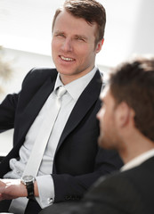 Fototapeta premium successful businessman with his colleague sitting behind a Desk.