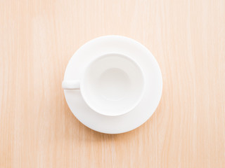 white coffee cup on wood table background