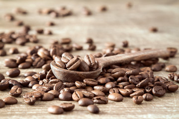 Wooden spoon with coffee beans