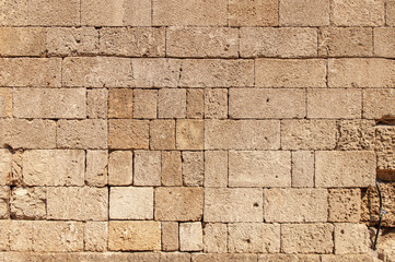 Pattern of yellow block from old architecture castle wall