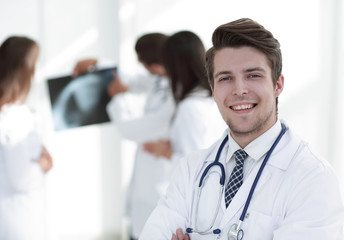 Fototapeta premium young doctor on the background of colleagues