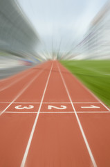 1 2 3 number start or finish position on race track in football stadium with zoom up blur