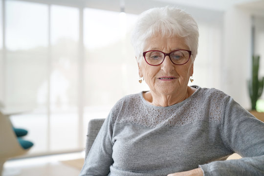 Portrait of elderly woman with thoughtful look