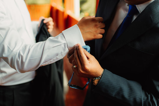 groom and best man getting ready