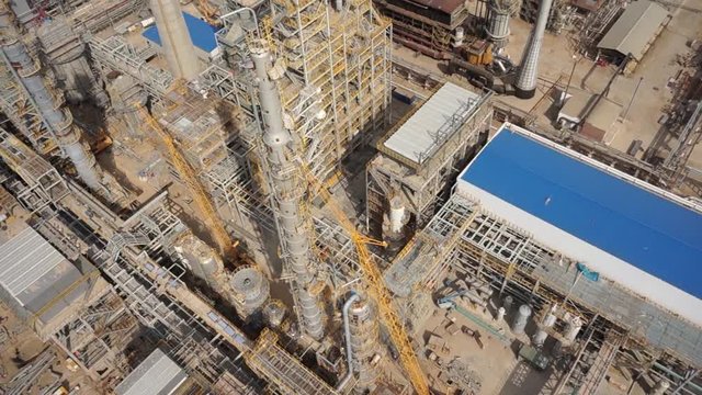 Aerial of oil refinery plant under construction 50p