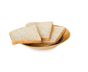 Sliced bread on brown ceramic plate with spoon isolated on white background