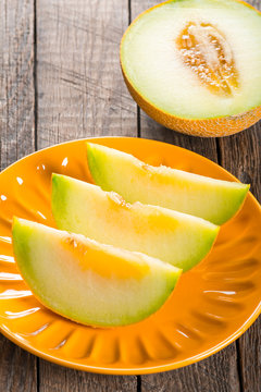 Sliced melon on plate