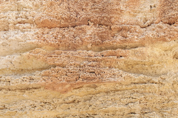 Red and yellow rocky mountain cliff natural texture wall background
