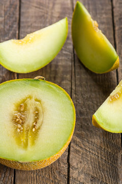 Sliced melon on wooden table