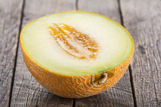 Sliced melon on wooden table