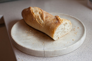 baguette on wooden plate