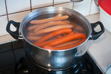 sausages in pot with water