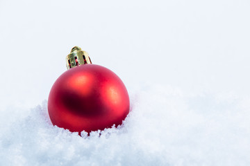christmas red ball on snow