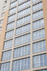 The facade of a new house with large windows