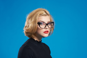 woman, glasses, blue background, close-up