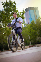Fototapeta na wymiar Young buinessman riding to work in the city