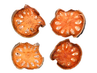 dry bael fruit tea (aegle marmelos) isolated on white background, herb for healthy beverage
