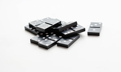 Domino sits in a pile. Isolated on a white background. Closeup