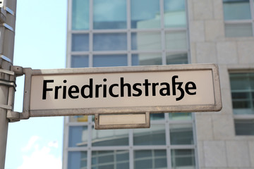 main street of Berlin in the road sign called friedrichstrasse t
