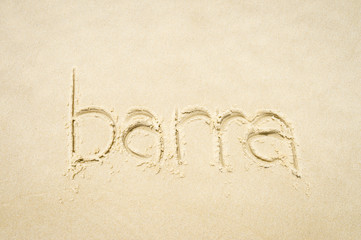 Barra, a beachside neighborhood of Rio de Janeiro, message handwritten on smooth sand beach Brazil