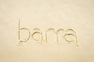 Barra, a beachside neighborhood of Rio de Janeiro, message handwritten on smooth sand beach Brazil