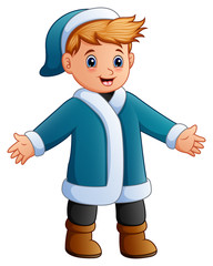 Happy boy in blue winter clothes