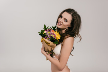 girl in lingerie holding flowers