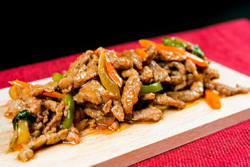 wok fried pork stir fry with sweet peppers and chinese vegetables