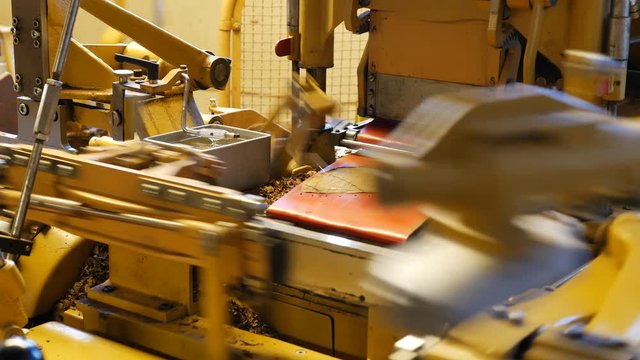 Cigar rolling machine inside a cigar factory producing homemade cigars &ndash; 4K