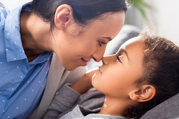 Fototapeta premium mother and daughter touching noses