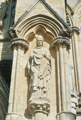LONDON, ENGLAND - AUGUST 02, 2013: Sculptures on the exterior of Salisbury Cathedral in Wiltshire. Example of early english gothic architecture.