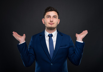 Businessman holding empty hands up