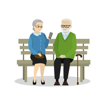 Old people sitting on the bench,grandmother with smartphone