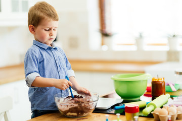 Cute child learning to become a chef
