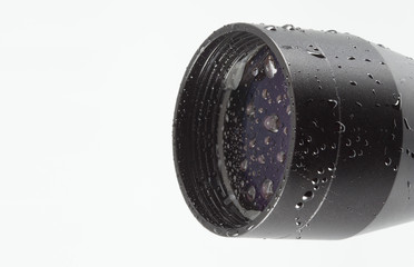 Rifle scope covered in water