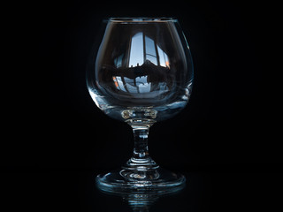 cognac glass on a black background