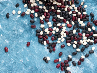 Haricot beans on blue wooden background.  Top view. 