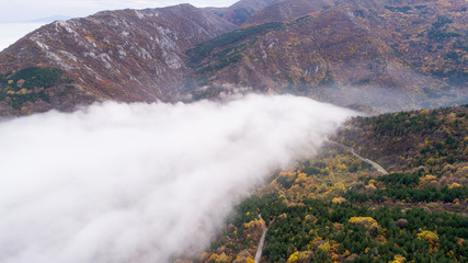 High Attitude Road In Mountain With A Lot Of Fog Aerial View