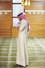 muslim man praying inside the mosque