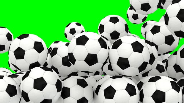 Animated a lot of simple soccer balls with white and black material tumbling or rolling and bouncing against green background filling up container