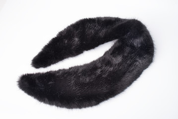 Black fur collar isolated on white background