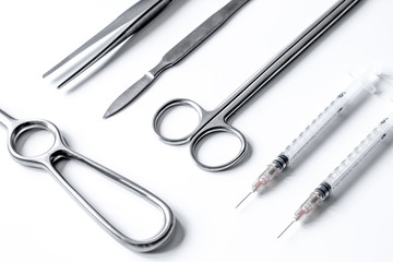 instruments for plastic surgery on white background