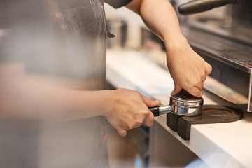Professional barista testing a new coffee machine