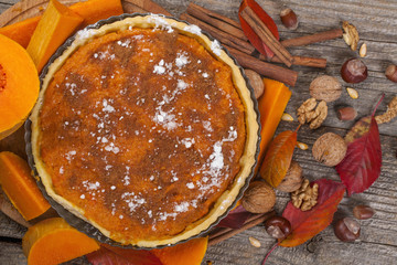 Homemade pie from organically grown pumpkins with autumn fruits