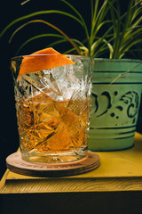 old fashioned classic cocktail in crystal glass