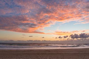 Fototapeta na wymiar Picturesque ocean beach on sunrise, sunset