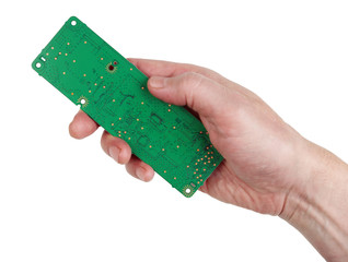The technician engineer keeps a new green electronic circuit board  isolated