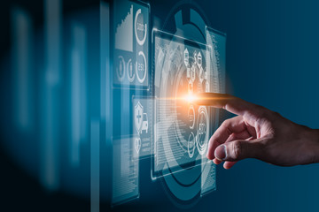 The abstract image of the hand point to the virtual hologram through the computer screen. the concept of communication network, cyber security, internet of things and future life.