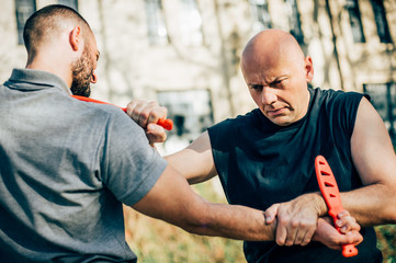 Knife vs knife. Kapap instructor demonstrates fighting and disarming technique